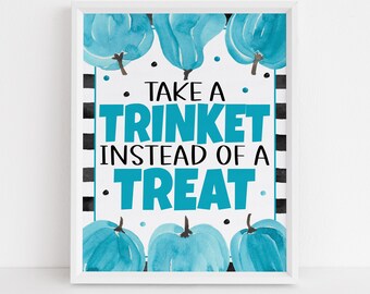 May include: A white framed sign with a black and white striped background. The sign says "Take a Trinket Instead of a Treat" in blue text. The sign is decorated with blue watercolor pumpkins.