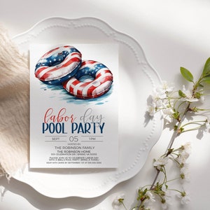 May include: Invitation to a Labor Day pool party with a watercolor illustration of two inflatable pool rings decorated with the American flag. The invitation includes the date, time, and location of the party.