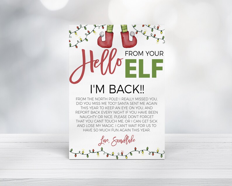 May include: A printable Christmas elf note with a red and green elf hat and the text "Hello Elf I'm Back!!" from your elf. The note includes a message from the elf about being back from the North Pole and keeping an eye on the children. The note is decorated with red and green Christmas lights.