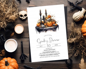 May include: A white invitation card with a spooky dinner theme. The card features a watercolor illustration of a black table with candles, pumpkins, and fall leaves. The text on the card reads "Join us for a Spooky Dinner, Oct 30, 6pm, Celebrating Jamie's Birthday, The Robinson Family, 555 Celebration Dr Spring VA 55555, Please join us to celebrate Jamie's 35th Birthday, Food, Drinks, & Friends, RSVP with Jamie by Oct 1st at 555-555-5555."