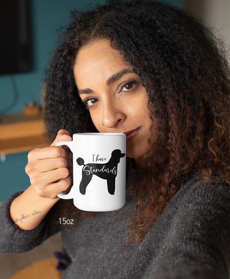 Woman Holding 15oz Mug with Black Standard Poodle Silhouette. I Have Standards