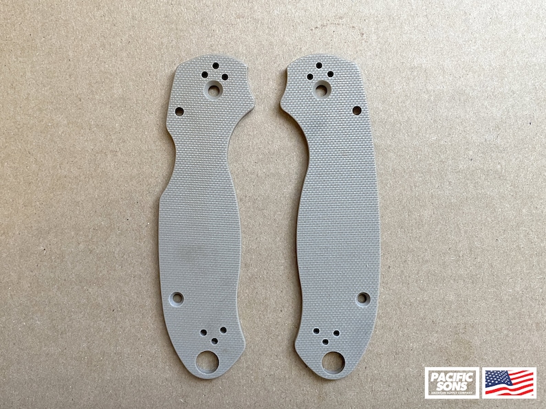 May include: Two beige plastic knife scales with multiple holes for mounting hardware. The scales have a textured surface.