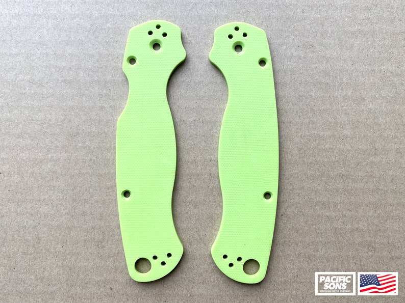May include: Two lime green knife scales with multiple holes for mounting. The scales are made of a textured material.