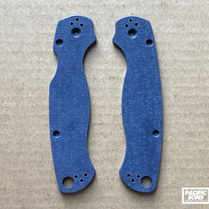 May include: Two blue textured plastic knife scales for a pocket knife. The scales have a textured surface and multiple holes for attaching to a knife.