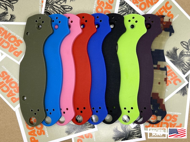 May include: Eight different colored knife scales, made of a textured material. The scales are in the following colors: olive green, blue, pink, red, blue, black, green, and purple.