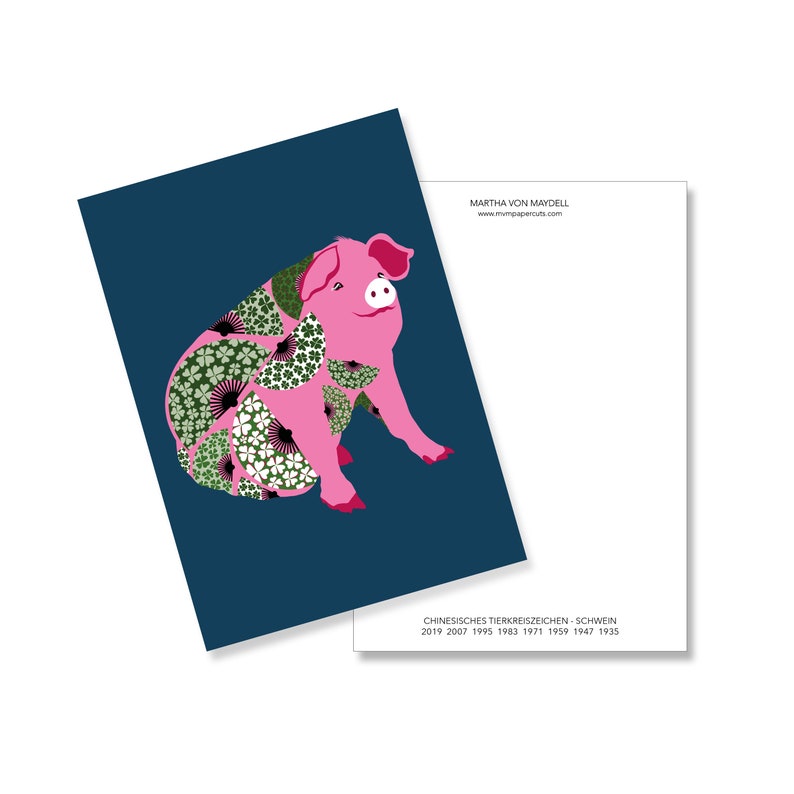 May include: A pink pig with a floral pattern on its body. The pig is sitting on a dark blue background. The text "CHINESE ZODIAC SIGN - PIG" and the years "2019 2007 1995 1983 1971 1959 1947 1935" are printed below the pig.