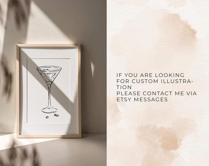 May include: A black and white line drawing of a martini glass on a white background. The glass is filled with a liquid and has a stem and a base. The image is framed in a light wood frame.