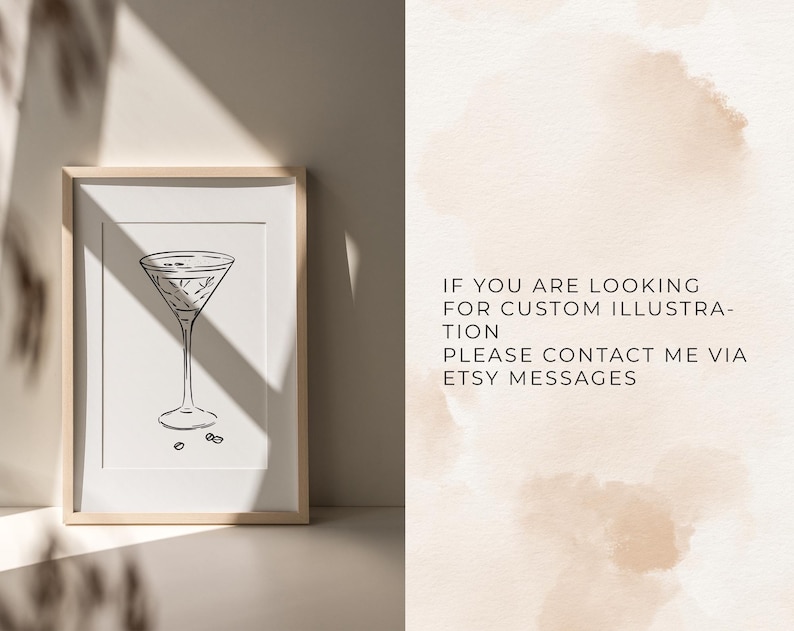 May include: A framed black and white line art print of a martini glass with two olives, accompanied by text that reads: IF YOU ARE LOOKING FOR CUSTOM ILLUSTRATION PLEASE CONTACT ME VIA ETSY MESSAGES. The print is displayed in a light wood frame.