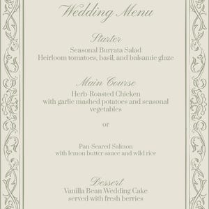 May include: A rectangular wedding menu card with a light beige background and a dark gray ornate scrollwork border. The text reads: Wedding Menu, Starter: Seasonal Burrata Salad, Main Course: Herb-Roasted Chicken or Pan-Seared Salmon, Dessert: Vanilla Bean Wedding Cake.