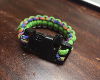 Bright Green and Rainbow Variegated Paracord bracelet with Whistle Buckle