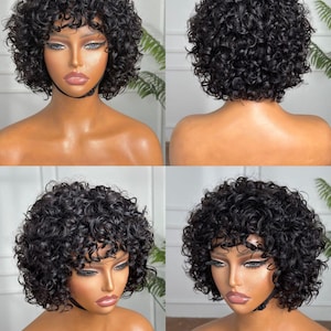 May include: A short, curly black wig with a blunt bang. The wig is styled in a voluminous, rounded shape. The image shows the wig from multiple angles, including front, back, and side views, showcasing its texture and style.