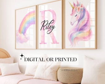 May include: Three framed art prints with a rainbow, a pink letter "R" with the name "Riley", and a unicorn. The prints have gold frames and are displayed above a bed with pink bedding. The text "DIGITAL OR PRINTED" is at the bottom.