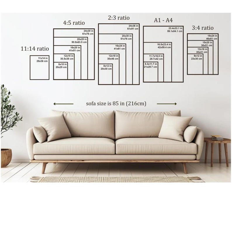 May include: A beige sofa with a light-colored rug and a small side table. Above the sofa, there are several black rectangular frames with size ratios and measurements in inches and centimeters. The text "sofa size is 85 in (216cm)" is also visible.