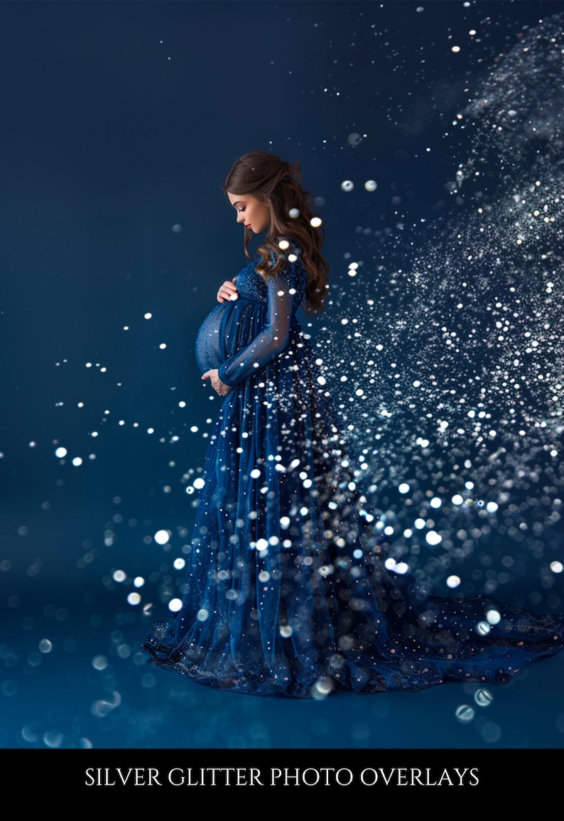 May include: A pregnant woman in a blue sparkly gown stands in front of a dark blue background with silver glitter falling around her.