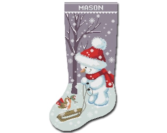 May include: A Christmas stocking with a snowman wearing a red hat and scarf, holding a rope. A small bird with a red breast is pulling a sled. The stocking is decorated with a snowy scene and the name "MASON" is at the top.