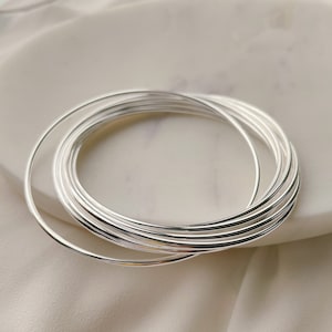 Dainty Sterling silver thin round staking bangle set bracelet, 1.5mm thin round Bangle, set of 9 Bangles, Sterling silver bangles