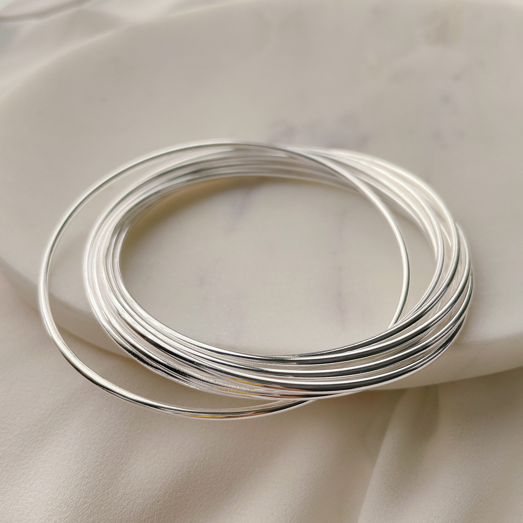 Sterling Silver Plated Interlocking Bangle Set - 9 Thin Round 1.5mm…