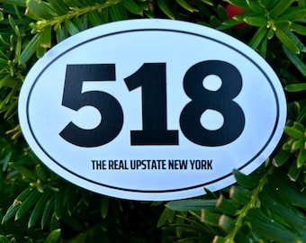 May include: White oval sticker with black text. The sticker says "518" and "The Real Upstate New York".