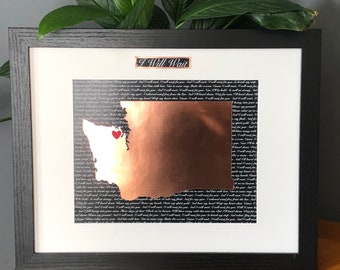 May include: A framed print of the state of Washington with a copper foil overlay and a red heart in the center. The background is black with the words "I Will Wait" repeated in white text.