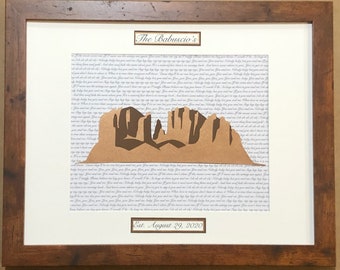 May include: A framed print with a brown paper cutout of a mountain range on a white background with a text pattern. The text reads "The Babuscio's Est. August 29, 2020".