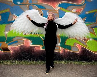White Angel Wings Costume: Large, moving wings for dancing and photo shoots