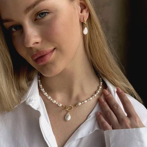 pearl pendant necklace and earrings