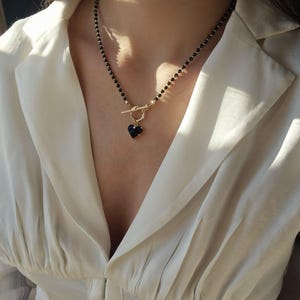 black spinel necklace with heart pendant
