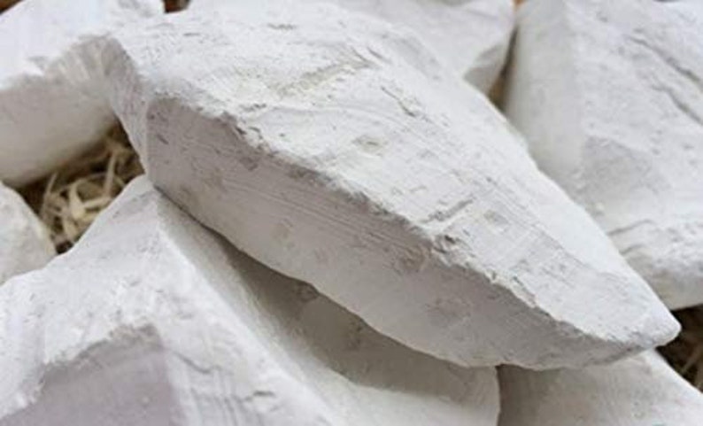 May include: A pile of white chalk rocks, perfect for drawing or crafting.