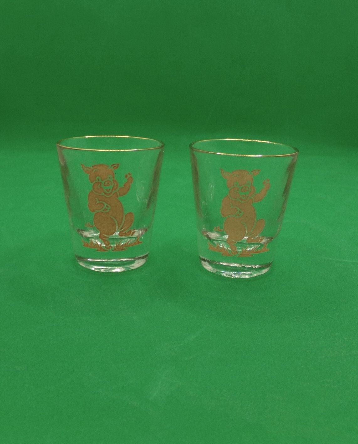 2 Vintage Glass Jiggers or Shot Glasses With Dancing Pigs