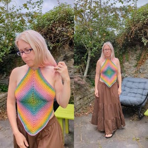 May include: A handmade, halter-style top in a vibrant rainbow gradient. The crochet top features a diamond-shaped design with colors blending from pink to yellow, green, and blue. The top is a unique piece of wearable art.