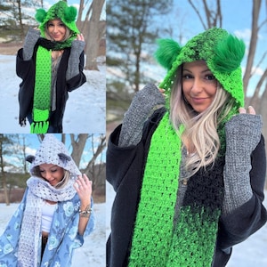 May include: Three women wearing crocheted hooded scarves with ear flaps. The scarves are in different colors, including green, black, and gray. The women are wearing the scarves in different ways, with some wearing them as hoods and others wearing them as scarves.