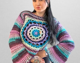 May include: A crocheted top with a colourful mandala design in shades of purple, blue, and green. The top has long sleeves with a bell shape and a cropped length.