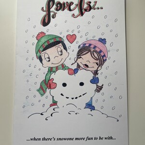 May include: A hand-drawn illustration of a couple building a snowman together in the snow. The text "Love Is..." is written at the top of the card. The text "...when there's snowone more fun to be with..." is written at the bottom of the card.