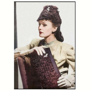 May include: A woman wearing a brown crocheted hat with a white flower accent, a beige blouse, and white gloves, holds a brown crocheted clutch bag.