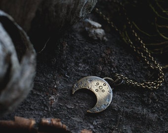 tiny brass lunula with delicate chain · magical · rustic ·