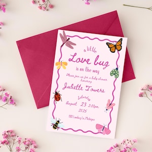 May include: A baby shower invitation with a pink border and the text "a little Love bug is on the way." The invitation is decorated with illustrations of butterflies, bees, and dragonflies. A magenta envelope is behind the invitation, surrounded by pink flowers.
