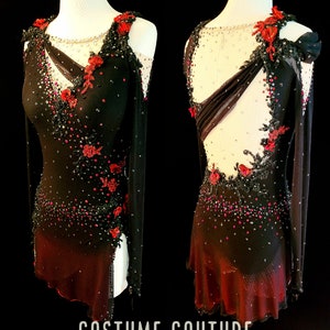 May include: A black and red figure skating costume with a sheer bodice, long sleeves, and a red ombre skirt. The costume is embellished with black lace, rhinestones, and red flowers. The text "COSTUME COUTURE by Naomi" is printed at the bottom of the image.