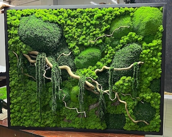 May include: A rectangular wall art piece featuring a vibrant green moss design with a black frame. The artwork incorporates natural elements like branches and hanging moss, creating a textured, organic aesthetic. The moss varies in shades of green.