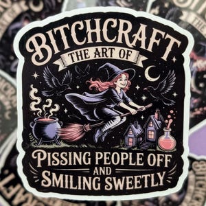May include: A black sticker with the text "BITCHCRAFT THE ART OF PISSING PEOPLE OFF AND SMILING SWEETLY." The sticker features a witch on a broom, a cauldron, ravens, and a crescent moon.