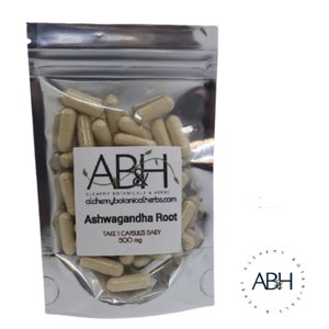 May include: A silver resealable pouch containing a large quantity of beige capsules. The pouch has a label that reads "ABH Alchemy Botanicals & Herbs alchemybotanicalherbs.com Ashwagandha Root Take 1 Capsules Daily 500 mg".