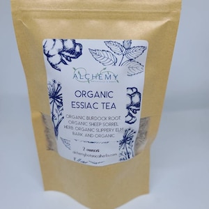 May include: A brown paper bag with a white label that says "Organic Essiac Tea" and lists the ingredients: Organic Burdock Root, Organic Sheep Sorrel Herb, Organic Slippery Elm Bark and Organic. The label also says "2 ounces" and "alchemybotanicalherbs.com".