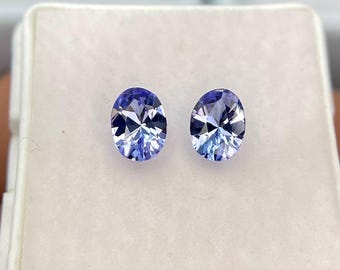 Par de tanzanitas naturales de 1,10 quilates, forma ovalada, talla maestra, facetadas, limpias a simple vista. Piedras preciosas sueltas a juego para joyería fina.