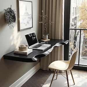 May include: A black floating desk with a unique wave-like edge, holding a laptop, books, and decorative items. A modern, minimalist design with a white chair and a view of a city street through a large window. The desk is approximately 152 cm long.