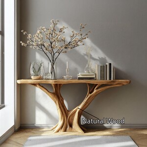 May include: A natural wood console table with a unique tree-like base. The table is adorned with decorative items, including vases, books, and a flowering branch. The table's dimensions are approximately 72 inches long, 16 inches wide, and 30 inches high.