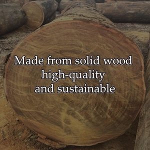 May include: A close-up of a cross-section of a large, brown log with visible wood grain. The text "Made from solid wood high-quality and sustainable" is overlaid on the image. The log is part of a larger collection of logs.