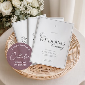 May include: White wedding ceremony programs with black text, including the words "Our Wedding Ceremony" and the names Sophie & Michael. The programs are in a woven basket with a floral arrangement in the background. A circular sticker reads "12 Page Editable Catholic Wedding Program."
