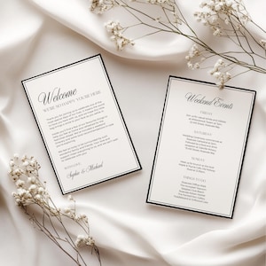 May include: Two rectangular white cards with black borders and elegant black typography. One card is titled Welcome and includes a personal note from Sophie and Michael. The second card is titled Weekend Events, listing Friday, Saturday, Sunday, and Things to Do.