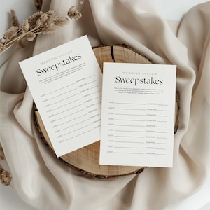 May include: Two white cards with black text that reads "Wedding Speech Sweepstakes". The cards have a list of guests and a space to write the duration of their speeches.