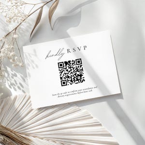 May include: A white RSVP card with black text and a QR code. The words "kindly RSVP" are at the top, with a prompt to scan the code for attendance and dietary requirements before June 10th.