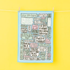 Typography tea towel of Norfolk sayings. Norfolk print. All your favourite Norwich and Norfolk funny quotes on one fun tea towel.